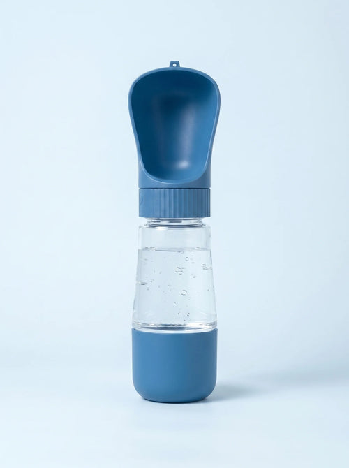 Coziekin 2-in-1 travel dog water bottle in blue, filled, with fold-out bowl
